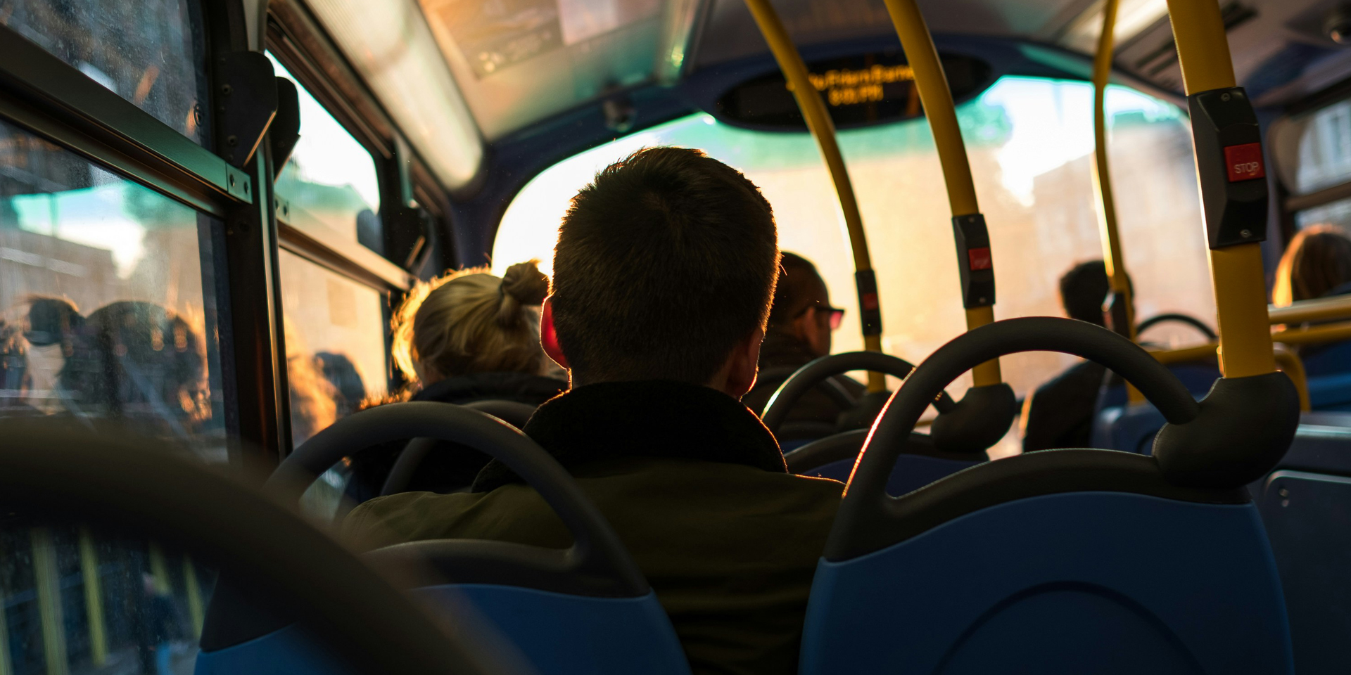 Photo of people sat in a bus
