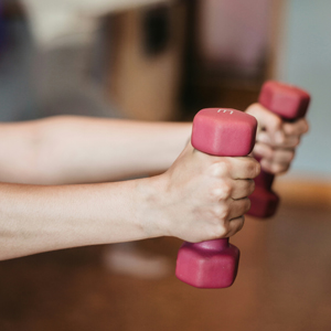 Image of lady holding light dumbbells